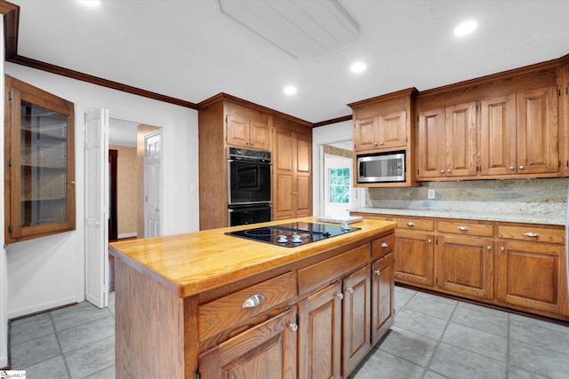 302 Spruce St, Clinton, SC 29325 - kitchen with black appliances, crown molding, recessed lighting, decorative backsplash, and brown cabinets