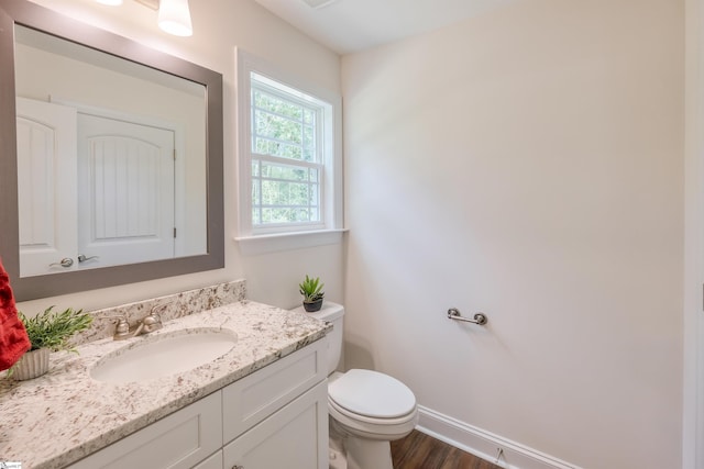 101 Poplar Ave, Belton, SC 29627 - half bathroom with toilet, vanity, wood finished floors, and baseboards