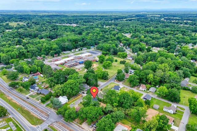 101 Poplar Ave, Belton, SC 29627 - aerial view of property and surrounding area featuring a heavily wooded area and nearby suburban area