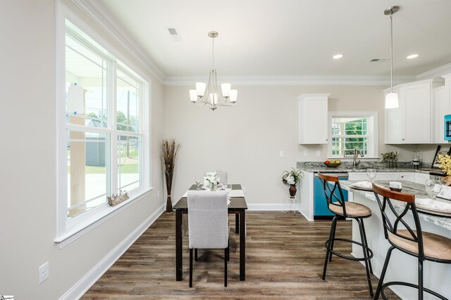 106 N St, Belton, SC 29627 - dining area featuring a chandelier, dark wood-style floors, crown molding, baseboards, and recessed lighting