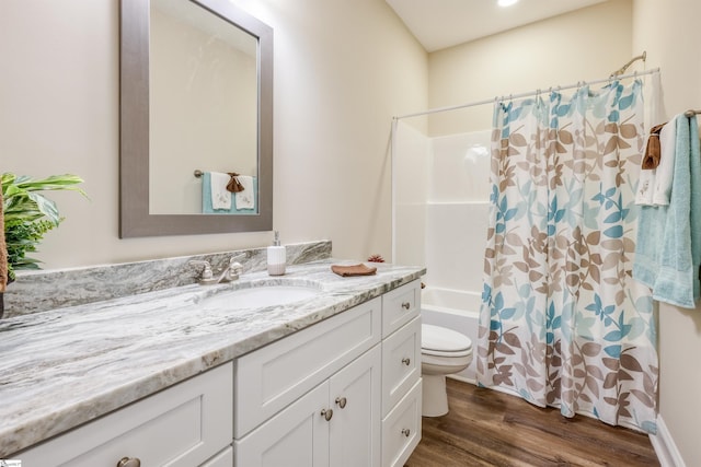 106 N St, Belton, SC 29627 - full bathroom with vanity, shower / tub combo, toilet, and wood finished floors