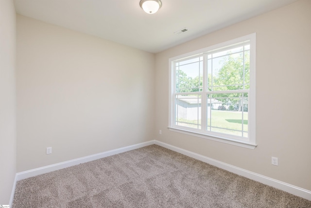 106 N St, Belton, SC 29627 - unfurnished room featuring carpet, healthy amount of natural light, and baseboards