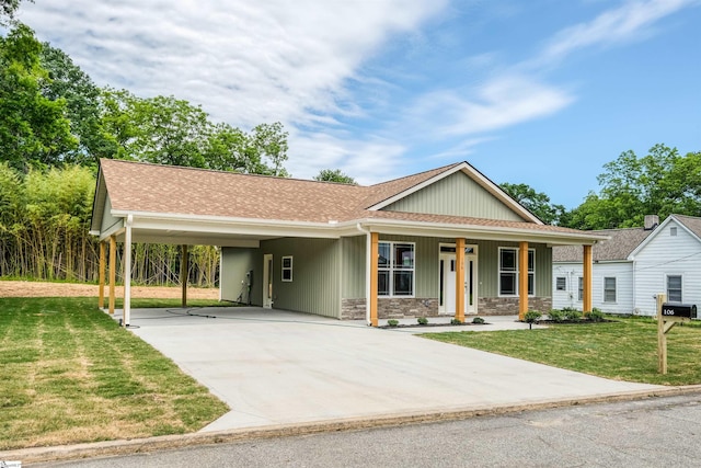 106 N St, Belton, SC 29627 - view of front of property featuring concrete driveway, a front yard, a shingled roof, and an attached carport