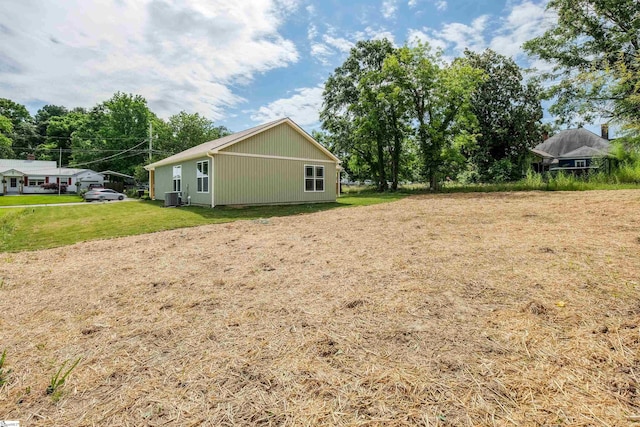 106 N St, Belton, SC 29627 - view of home's exterior featuring central AC and a yard