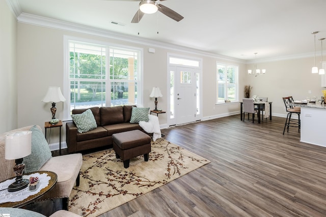 106 N St, Belton, SC 29627 - living room featuring wood finished floors, ornamental molding, a ceiling fan, a chandelier, and baseboards