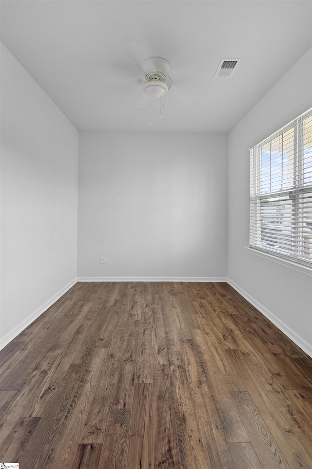 1072 Longstone Way, Spartanburg, SC 29306 - spare room featuring dark wood-type flooring, baseboards, and a ceiling fan