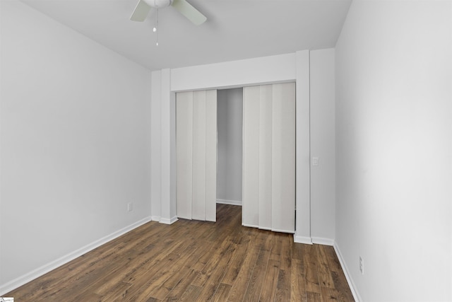 1072 Longstone Way, Spartanburg, SC 29306 - unfurnished bedroom featuring dark wood-style floors, a closet, baseboards, and a ceiling fan