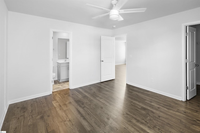1072 Longstone Way, Spartanburg, SC 29306 - unfurnished bedroom with dark wood-type flooring, baseboards, ensuite bath, a spacious closet, and a ceiling fan