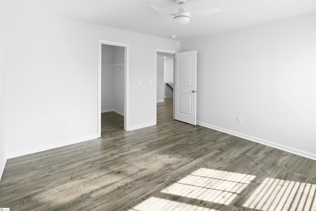 1072 Longstone Way, Spartanburg, SC 29306 - unfurnished bedroom featuring a spacious closet, baseboards, wood finished floors, a closet, and ceiling fan