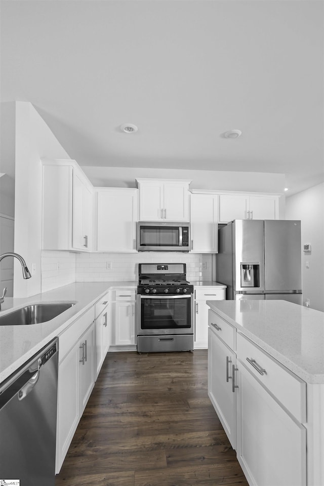 1072 Longstone Way, Spartanburg, SC 29306 - kitchen with appliances with stainless steel finishes, a sink, backsplash, white cabinetry, and recessed lighting