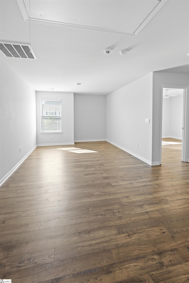 1072 Longstone Way, Spartanburg, SC 29306 - unfurnished room featuring attic access, dark wood-style flooring, and baseboards