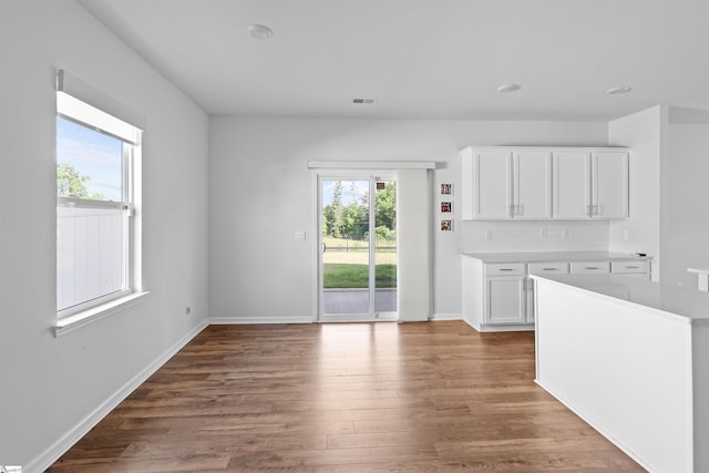1072 Longstone Way, Spartanburg, SC 29306 - unfurnished living room with dark wood-type flooring and baseboards