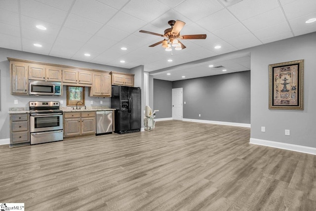 67 Devonhall Way, Taylors, SC 29687 - kitchen featuring appliances with stainless steel finishes, baseboards, light wood-style flooring, ceiling fan, and a paneled ceiling