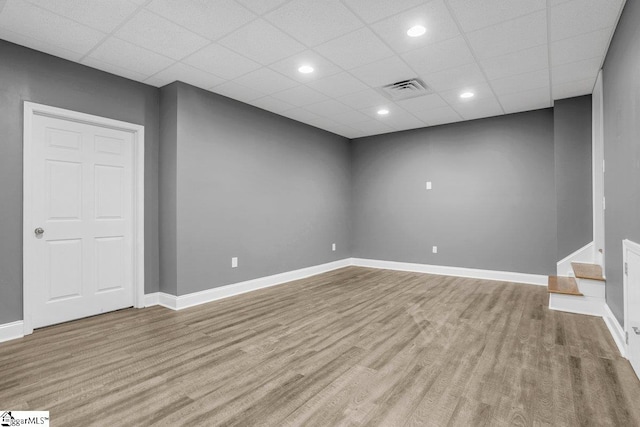 67 Devonhall Way, Taylors, SC 29687 - basement featuring wood finished floors, baseboards, a paneled ceiling, and recessed lighting