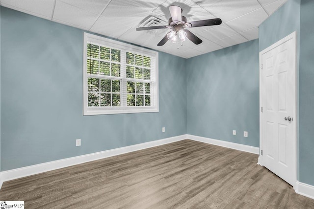 67 Devonhall Way, Taylors, SC 29687 - empty room with ceiling fan, wood finished floors, baseboards, and a drop ceiling