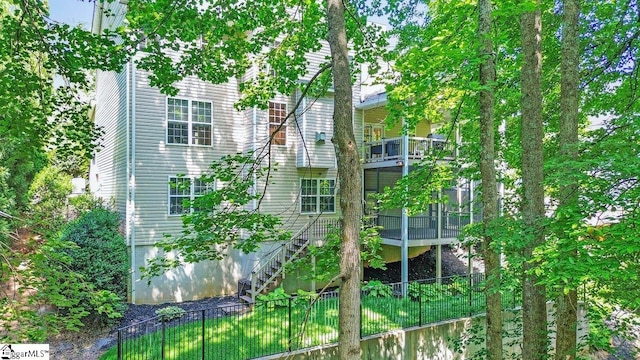 67 Devonhall Way, Taylors, SC 29687 - view of property exterior featuring a fenced backyard, stairs, and a sunroom