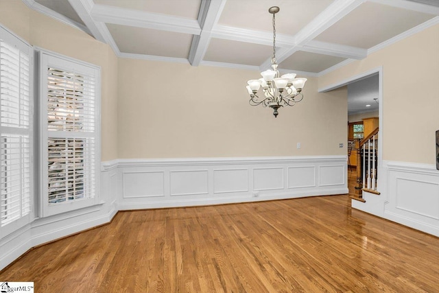 67 Devonhall Way, Taylors, SC 29687 - unfurnished dining area with coffered ceiling, a chandelier, light wood-style flooring, plenty of natural light, and beamed ceiling