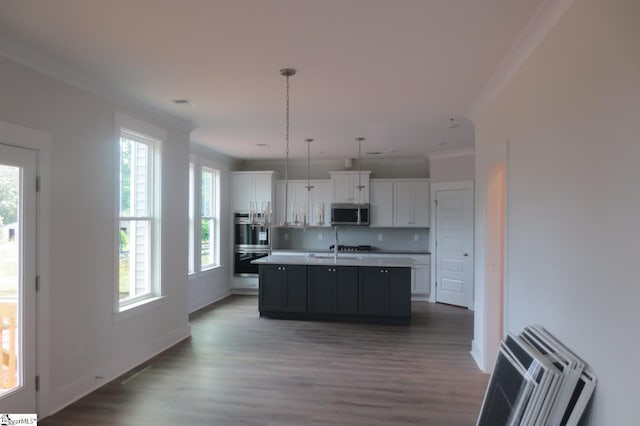 3140 Midway Rd Lot 97, Anderson, SC 29621 - kitchen featuring appliances with stainless steel finishes, crown molding, dark wood finished floors, white cabinetry, and an island with sink