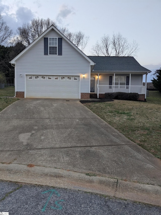 7 Willow Wood Ct, Taylors, SC 29687 - view of front of house featuring concrete driveway, a porch, a front yard, and brick siding