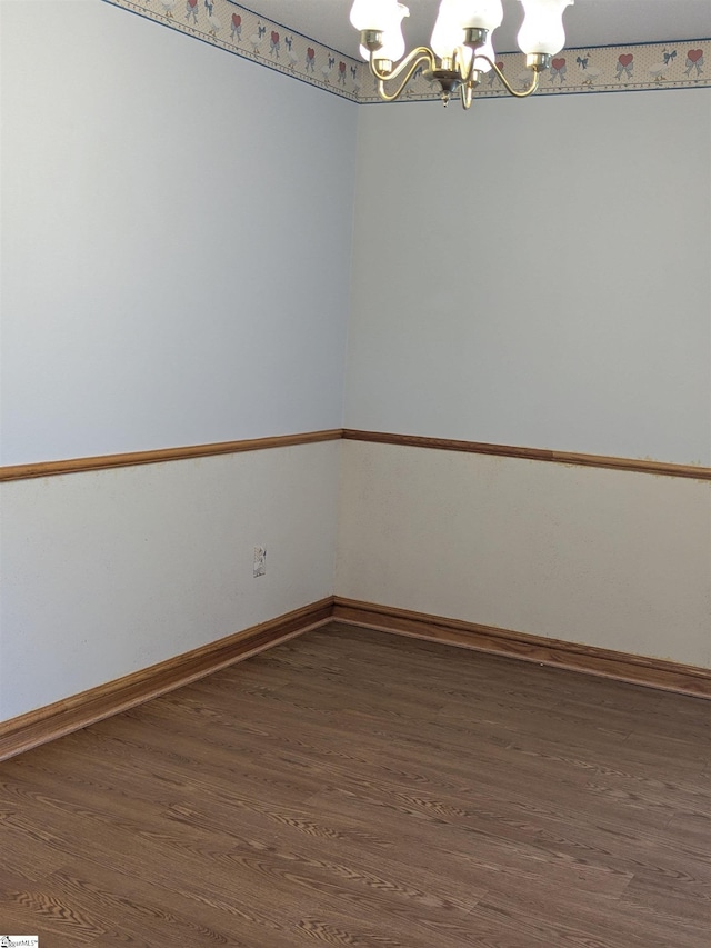 7 Willow Wood Ct, Taylors, SC 29687 - spare room featuring a chandelier, wood finished floors, and baseboards