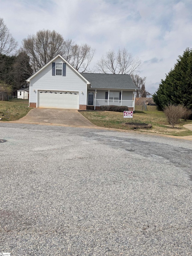 7 Willow Wood Ct, Taylors, SC 29687 - view of front of house featuring a garage, covered porch, and driveway