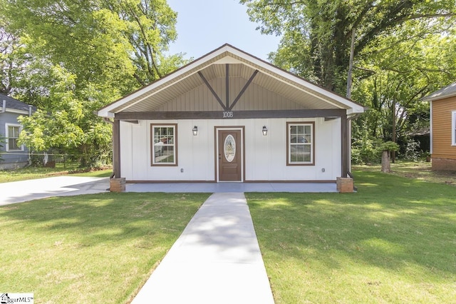 1008 Tribble St, Anderson, SC 29625 - bungalow with a porch, a front lawn, and board and batten siding
