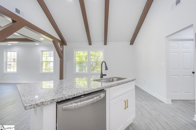 1008 Tribble St, Anderson, SC 29625 - kitchen featuring stainless steel dishwasher, a sink, open floor plan, light stone counters, and light wood-style floors