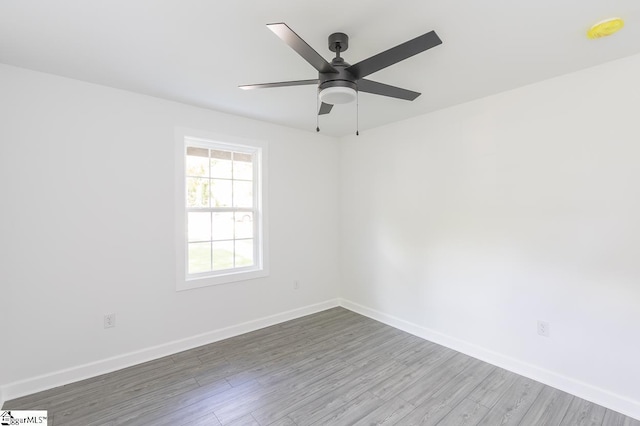 1008 Tribble St, Anderson, SC 29625 - spare room with wood finished floors, baseboards, and ceiling fan