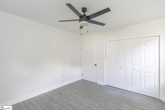 1008 Tribble St, Anderson, SC 29625 - unfurnished bedroom featuring wood finished floors, baseboards, a closet, and a ceiling fan