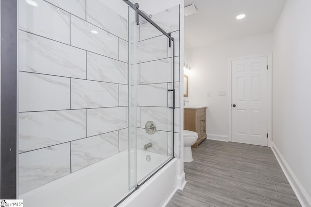 1008 Tribble St, Anderson, SC 29625 - full bath with vanity, shower / bath combination with glass door, baseboards, wood finished floors, and recessed lighting