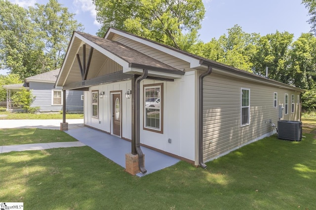 1008 Tribble St, Anderson, SC 29625 - view of front facade featuring central air condition unit, a front yard, and roof with shingles