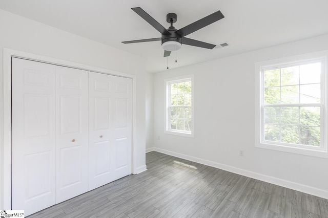 1008 Tribble St, Anderson, SC 29625 - unfurnished bedroom featuring baseboards, light wood-style floors, a closet, and ceiling fan
