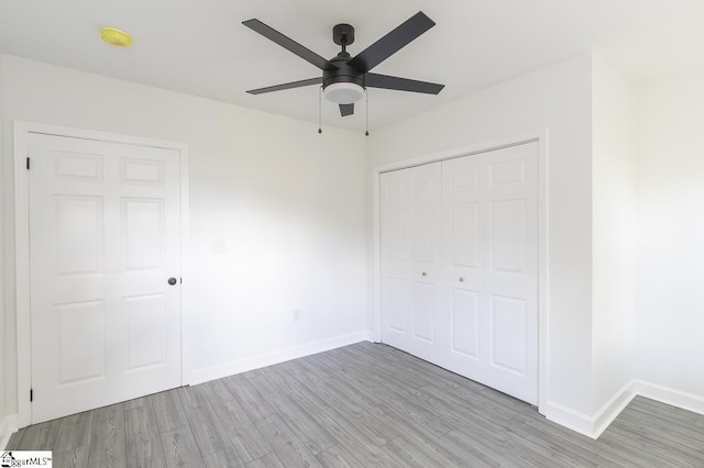 1008 Tribble St, Anderson, SC 29625 - unfurnished bedroom featuring baseboards, light wood-style floors, a closet, and a ceiling fan