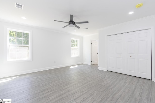 1008 Tribble St, Anderson, SC 29625 - unfurnished bedroom with crown molding, light wood finished floors, baseboards, a closet, and ceiling fan