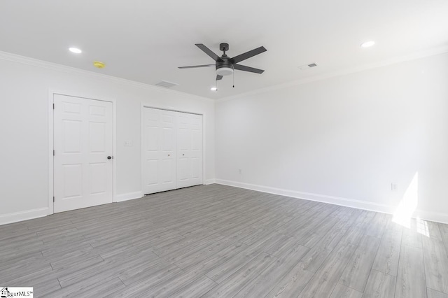 1008 Tribble St, Anderson, SC 29625 - unfurnished bedroom with ornamental molding, light wood-style floors, baseboards, and recessed lighting