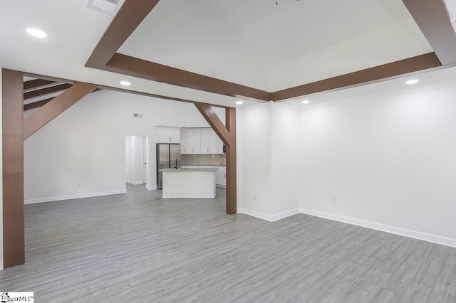 1008 Tribble St, Anderson, SC 29625 - unfurnished living room with recessed lighting, light wood-style flooring, baseboards, and stairway
