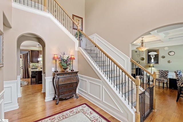 100 Claiborne Rd, Piedmont, SC 29673 - stairway with coffered ceiling, wood finished floors, arched walkways, beam ceiling, and a towering ceiling