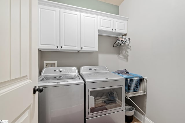100 Claiborne Rd, Piedmont, SC 29673 - laundry room featuring separate washer and dryer, cabinet space, and baseboards