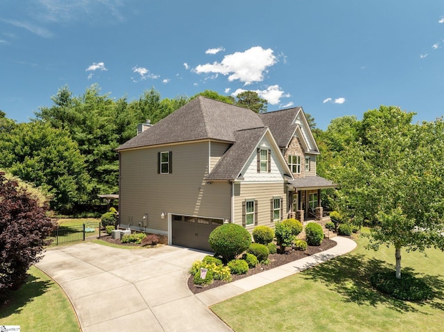 100 Claiborne Rd, Piedmont, SC 29673 - craftsman house featuring concrete driveway, a garage, a shingled roof, and a porch