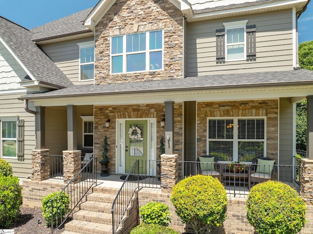 100 Claiborne Rd, Piedmont, SC 29673 - craftsman-style home featuring covered porch, roof with shingles, and stone siding