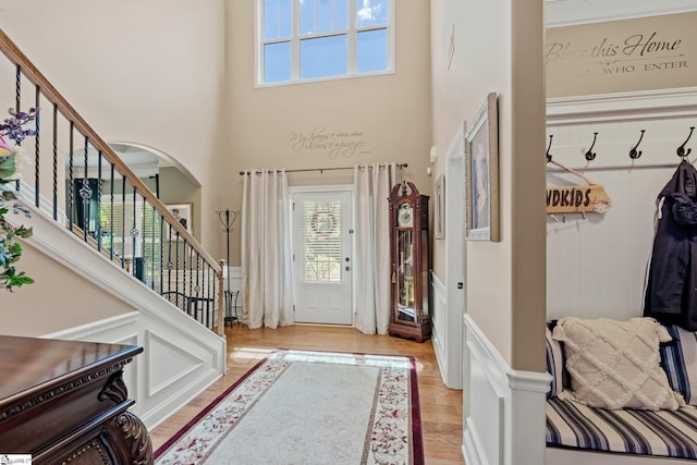 100 Claiborne Rd, Piedmont, SC 29673 - foyer entrance featuring arched walkways, a high ceiling, stairway, and wood finished floors