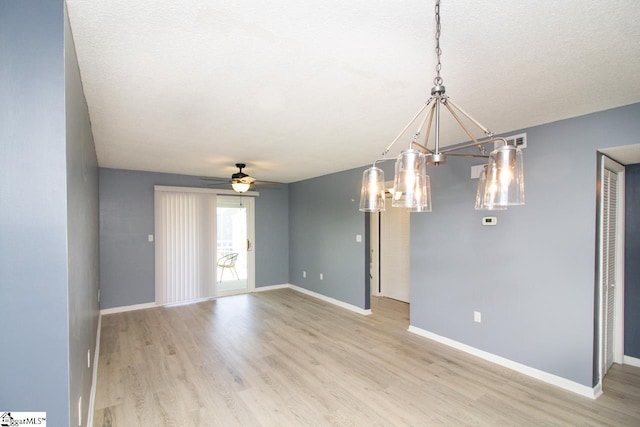 1507 Northlake Dr, Anderson, SC 29625 - empty room with a chandelier, light wood-style flooring, baseboards, and a ceiling fan