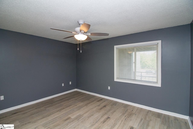1507 Northlake Dr, Anderson, SC 29625 - spare room with wood finished floors, ceiling fan, a textured ceiling, and baseboards