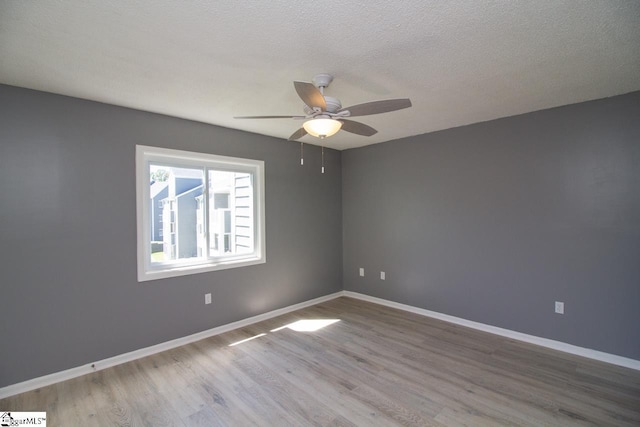 1507 Northlake Dr, Anderson, SC 29625 - empty room featuring wood finished floors, ceiling fan, baseboards, and a textured ceiling