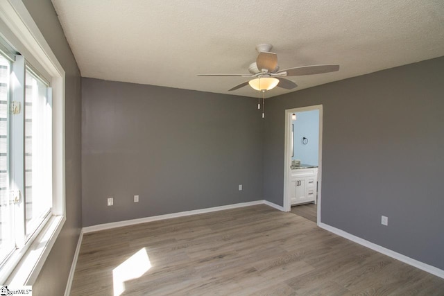 1507 Northlake Dr, Anderson, SC 29625 - unfurnished room featuring ceiling fan, light wood-type flooring, a textured ceiling, and baseboards