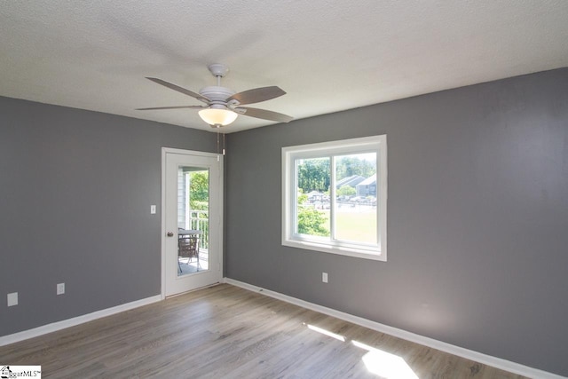 1507 Northlake Dr, Anderson, SC 29625 - unfurnished room with wood finished floors, ceiling fan, baseboards, and a textured ceiling