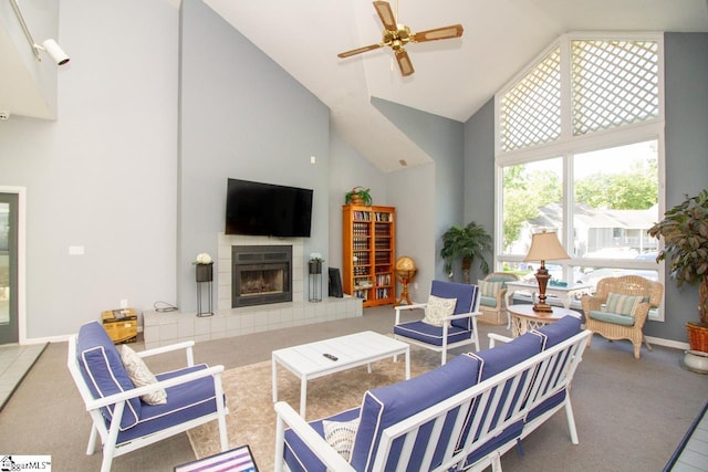 1507 Northlake Dr, Anderson, SC 29625 - living room with high vaulted ceiling, a ceiling fan, a tiled fireplace, carpet flooring, and baseboards