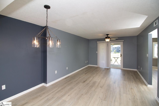 1507 Northlake Dr, Anderson, SC 29625 - unfurnished room with a chandelier, light wood-style floors, baseboards, a ceiling fan, and a textured ceiling