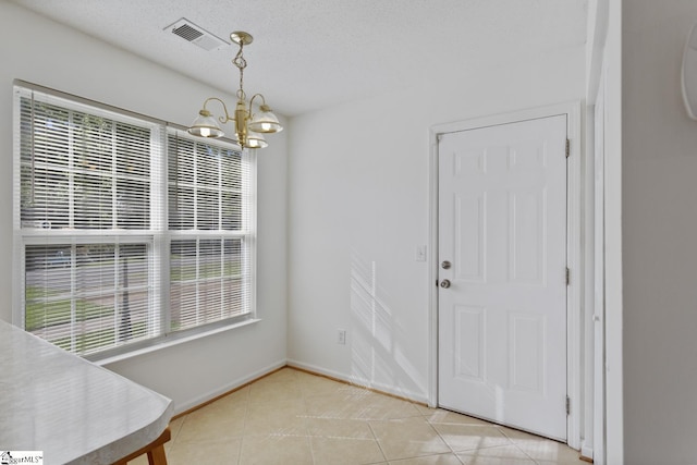 103 Berry Ct, Belton, SC 29627 - unfurnished dining area with a chandelier, light tile patterned floors, and baseboards