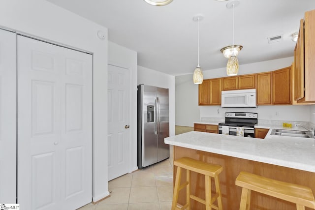103 Berry Ct, Belton, SC 29627 - kitchen featuring stainless steel appliances, a sink, a peninsula, light countertops, and light tile patterned flooring
